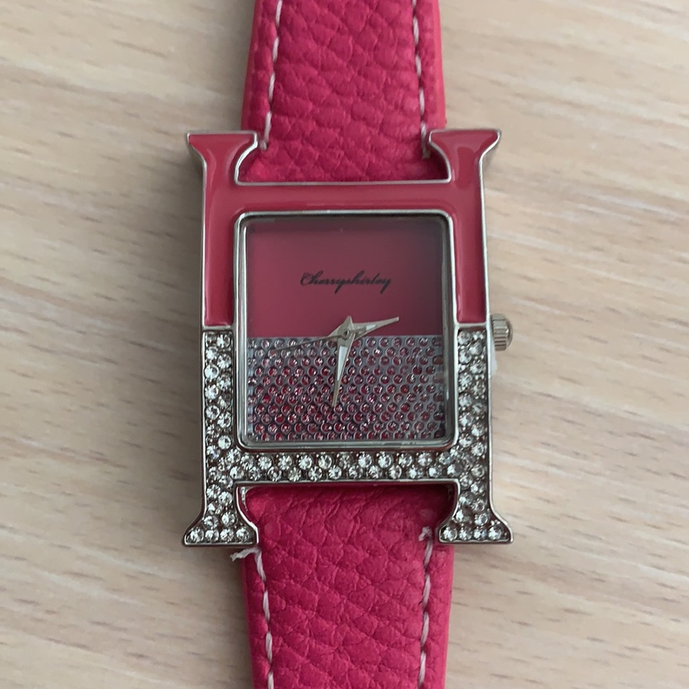 Cute hot pink good size watch with rhinestones.